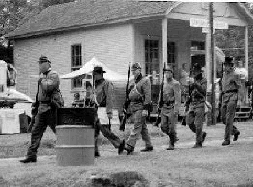 Reenactors marching past Post Office Museum